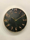 Modern wall clock for living room décor
Wall clock with gold casing and bronze Roman numerals on a white wall