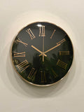 Wall clock with black face and gold Roman numerals on a white wall
Modern wall clock for living room décor