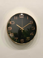 Modern wall clock for living room décor
Wall clock with black face and rose gold hands on a white wall