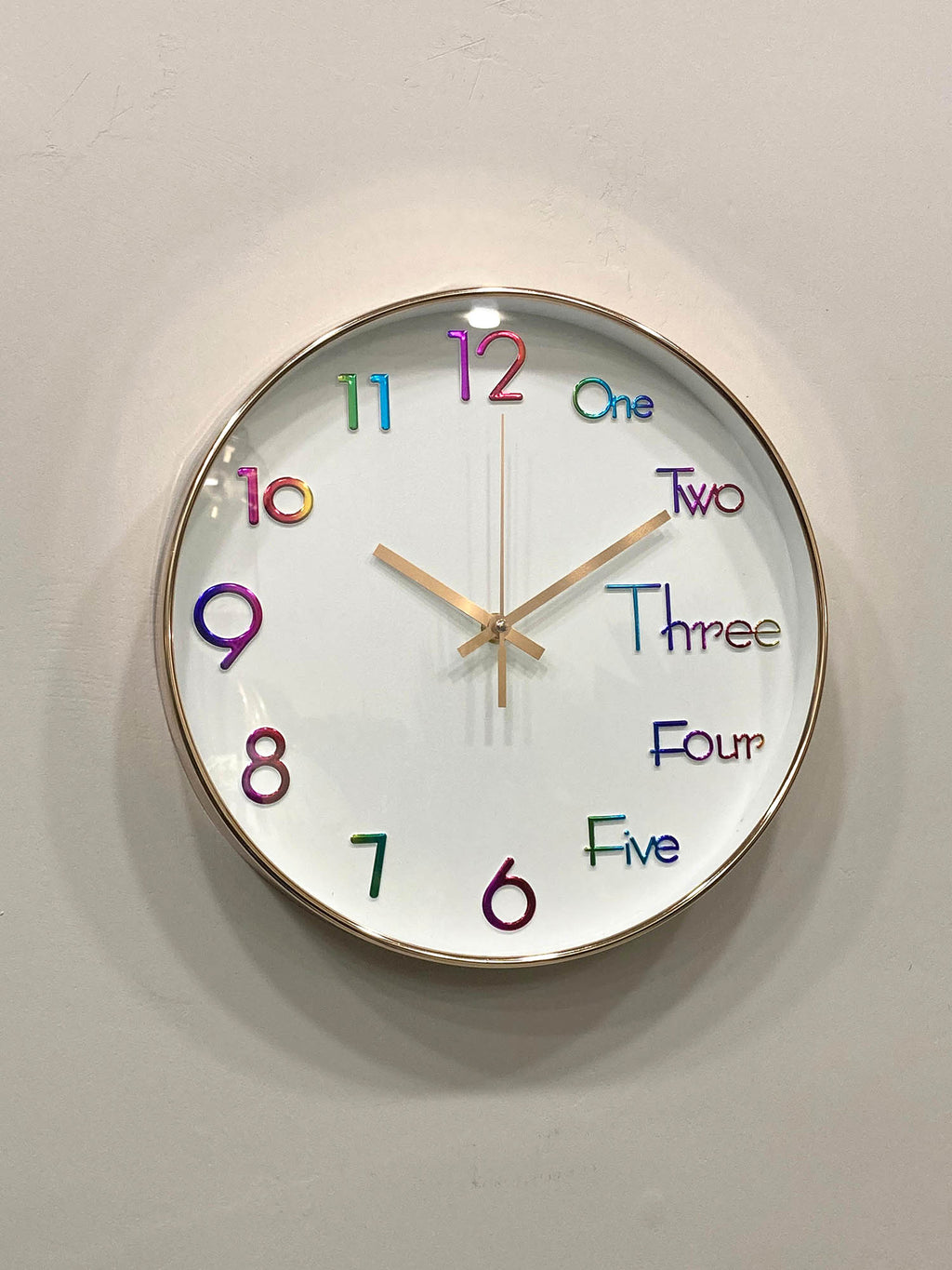 Modern wall clock for living room décor
Colorful clock with numbers and letters on a white wall suitable for kids room clock 