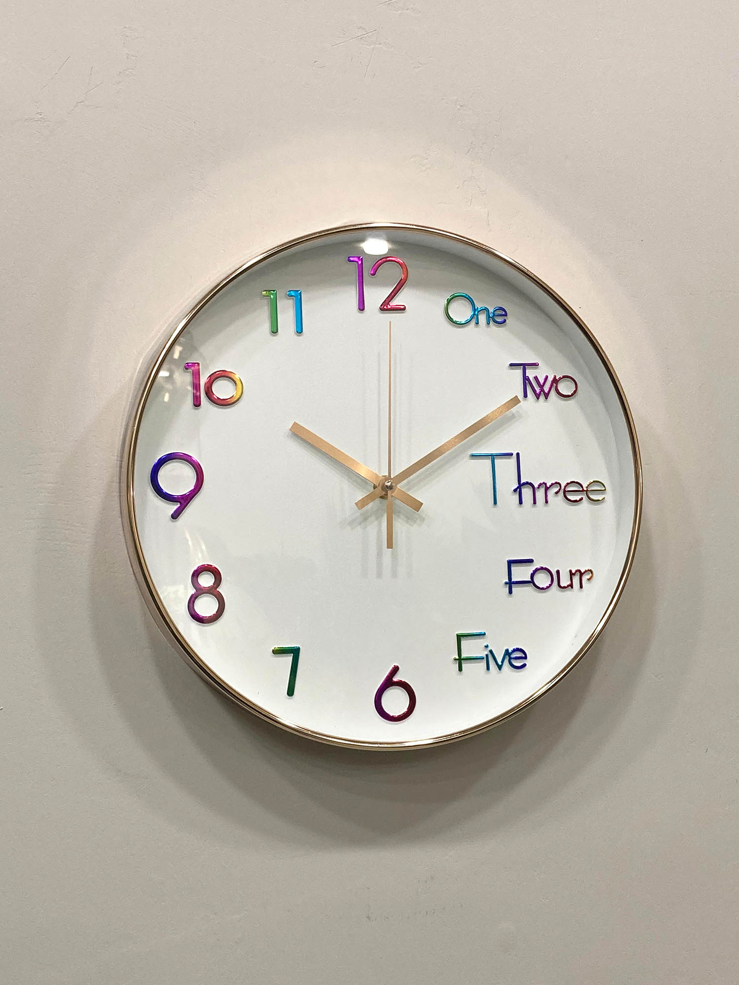 Modern wall clock for living room décor
Colorful clock with numbers and letters on a white wall suitable for kids room clock 