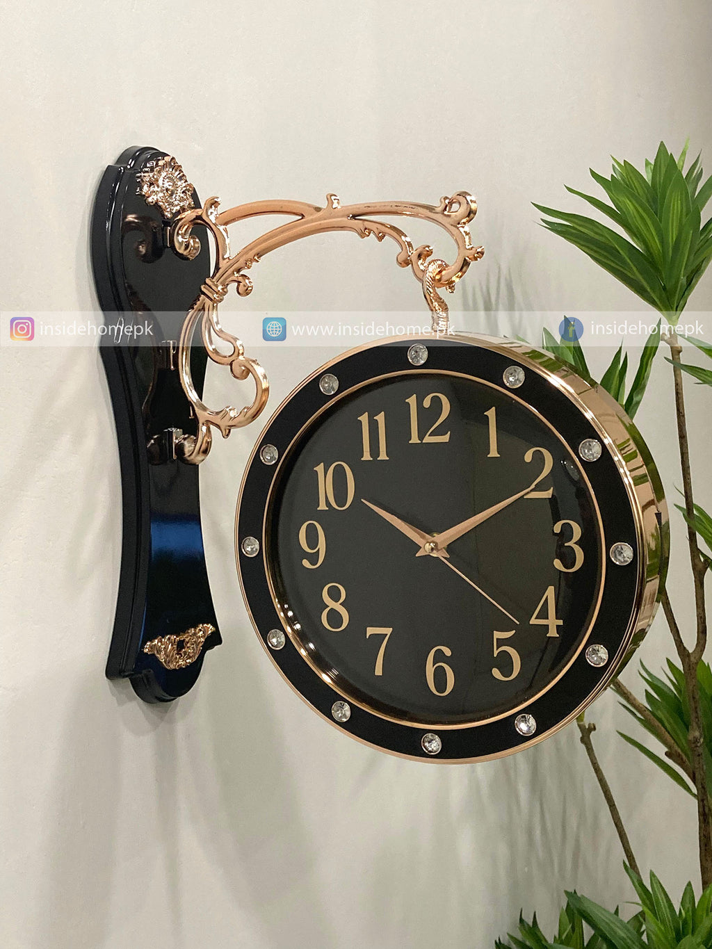 Decorative wall clock Modern wall clock for living room décor with black face and gold accents on a white background