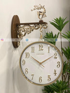 Decorative Modern wall clock for living room décor with gold accents on a white wall.