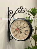 Decorative Modern wall clock for living room décor with floral design and 'HOME' text on a white wall with plants.
