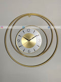 Gold circular Modern wall clock for living room décor on a gray background