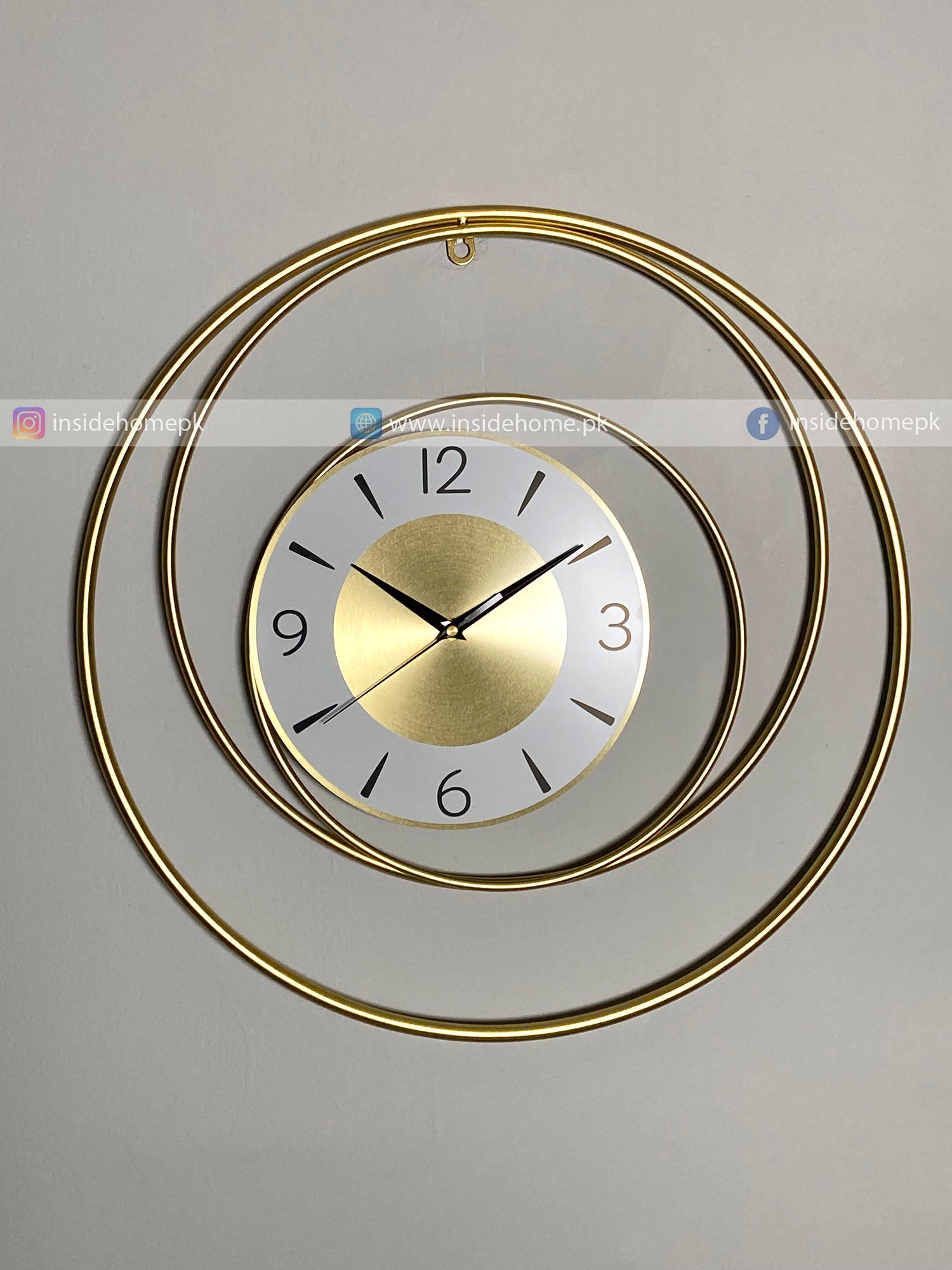 Gold circular Modern wall clock for living room décor on a gray background
