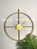 Gold Modern wall clock for living room décor with a minimalist design on a light background