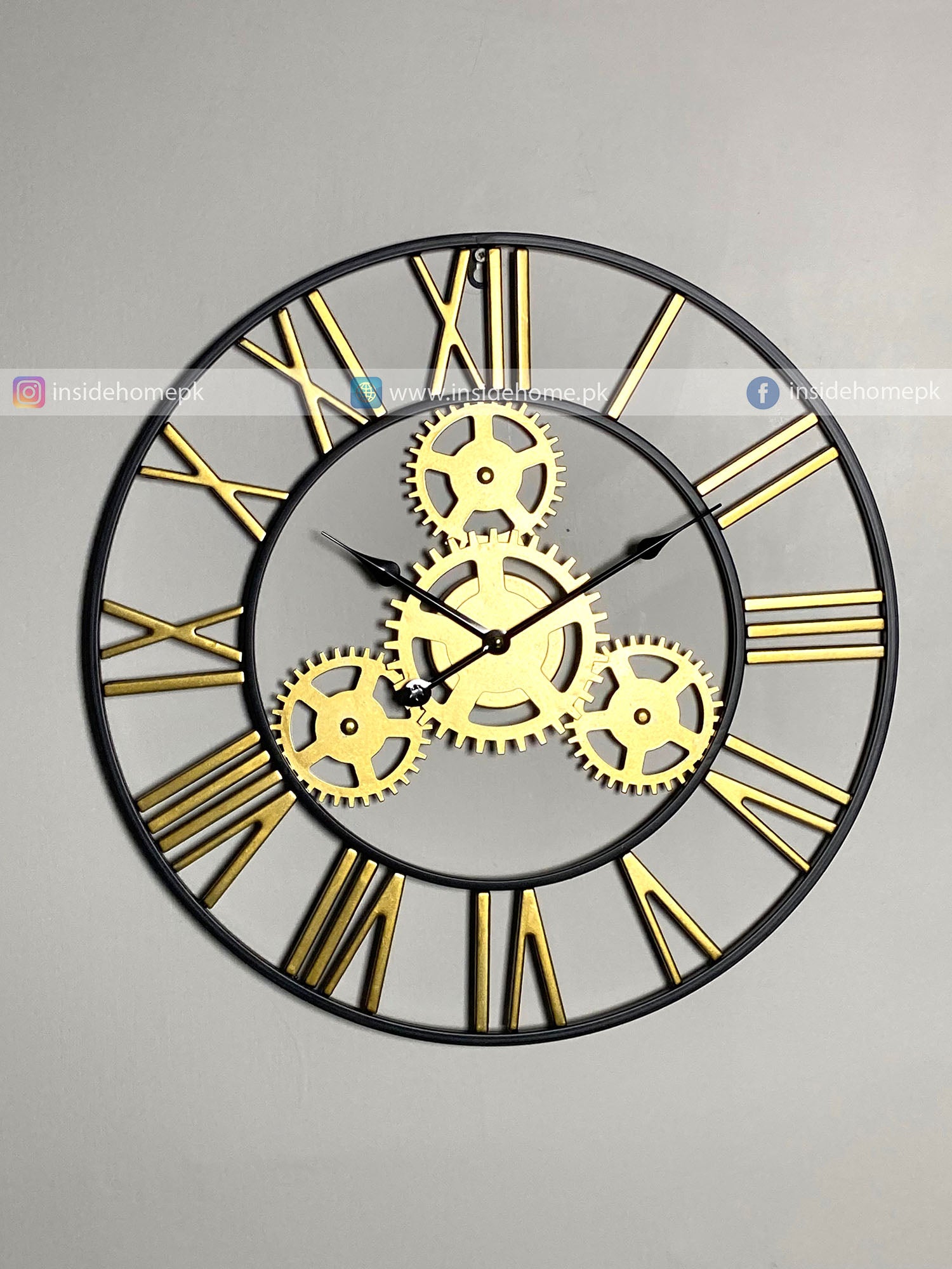 Decorative Modern wall clock for living room décor with gold gears and Roman numerals on a gray background