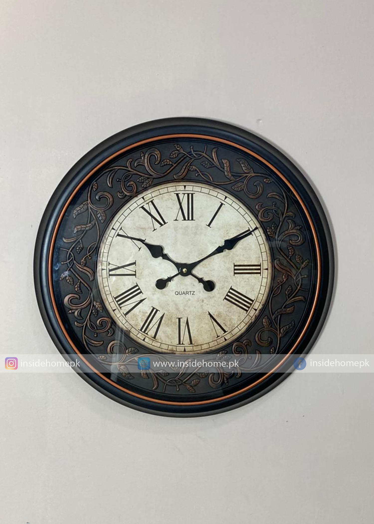 Modern wall clock for living room décor 
Decorative wall clock with Roman numerals on a white background